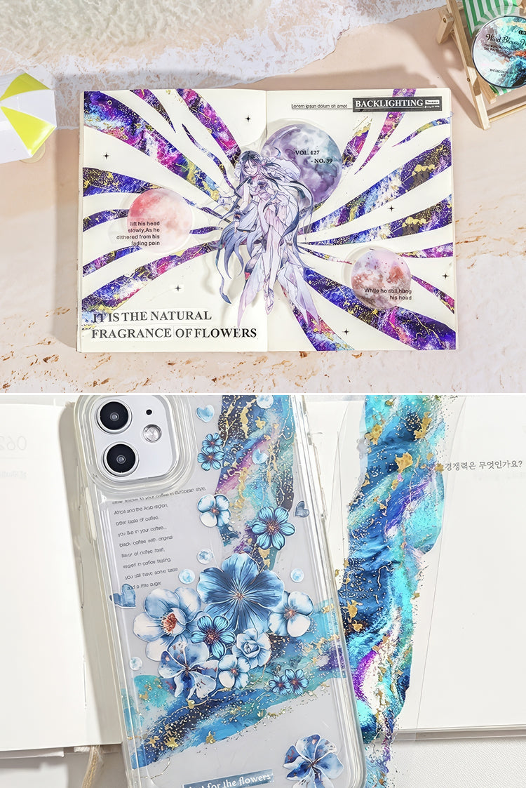 Open notebook with purple and gold abstract art paired with a clear phone case adorned with blue floral designs