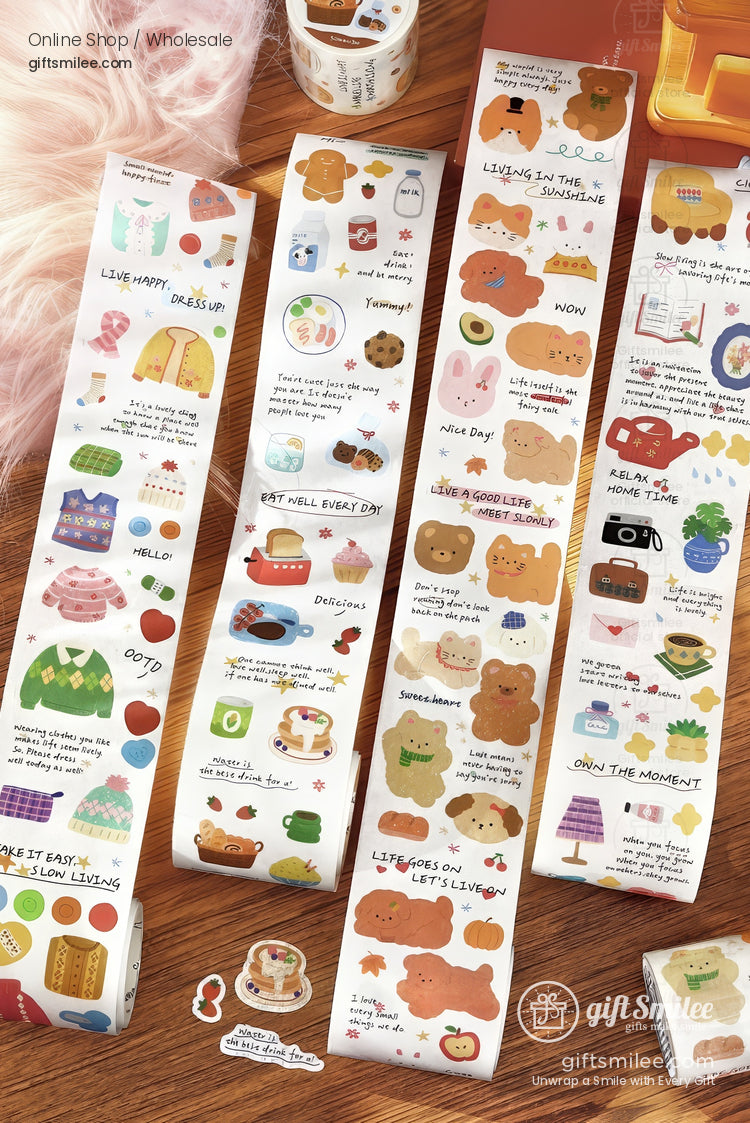 Colorful sticker rolls with cute bear designs cozy sweaters food illustrations and motivational text in a playful style