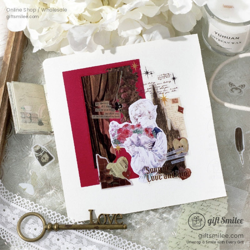 Romantic handmade collage card with red accents vintage illustrations lace trim and a decorative brass key