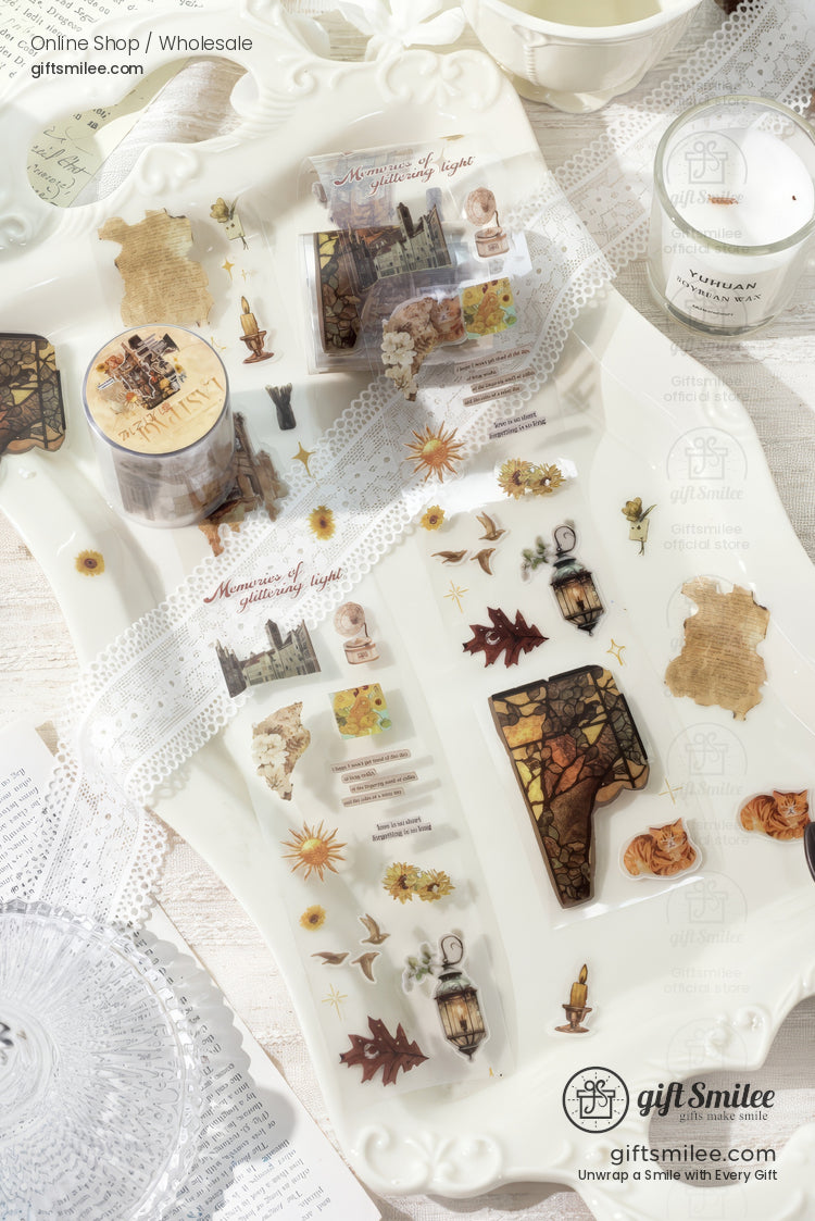 Vintagethemed translucent stickers with autumn leaves lanterns castles and lace details on a white ornate tray