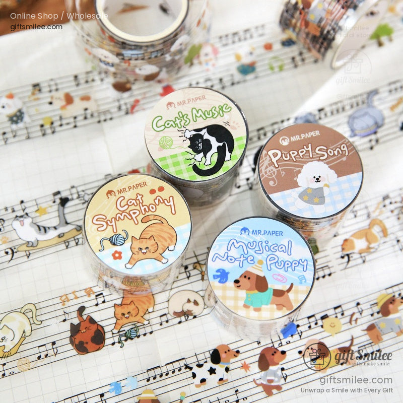 Decorative washi tape rolls with musical notes playful cats and dogs in pastel tones on patterned backgrounds