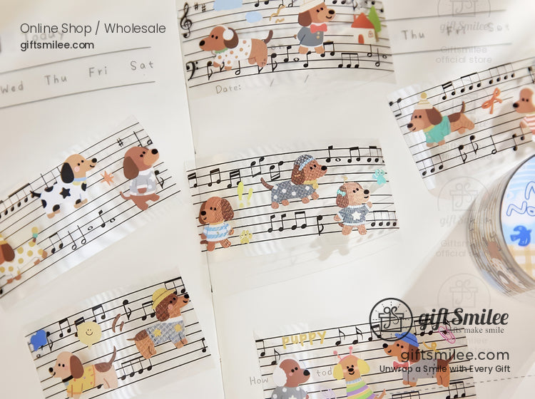 Decorative washi tape with playful brown dog illustrations on black and white musical staff patterns