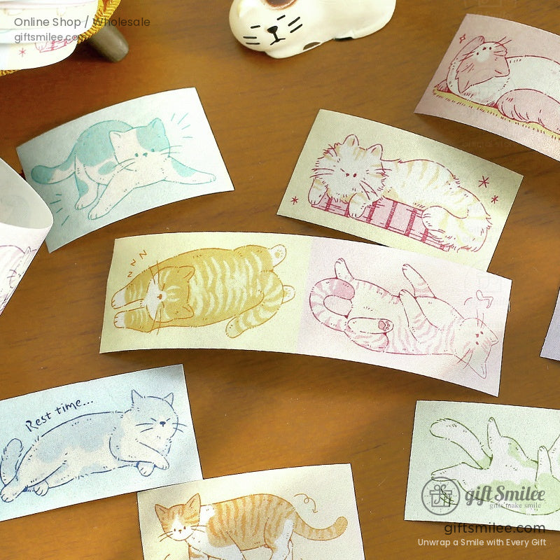 Pastelcolored cat stickers in playful poses featuring soft illustrations on rectangular paper with a cozy aesthetic