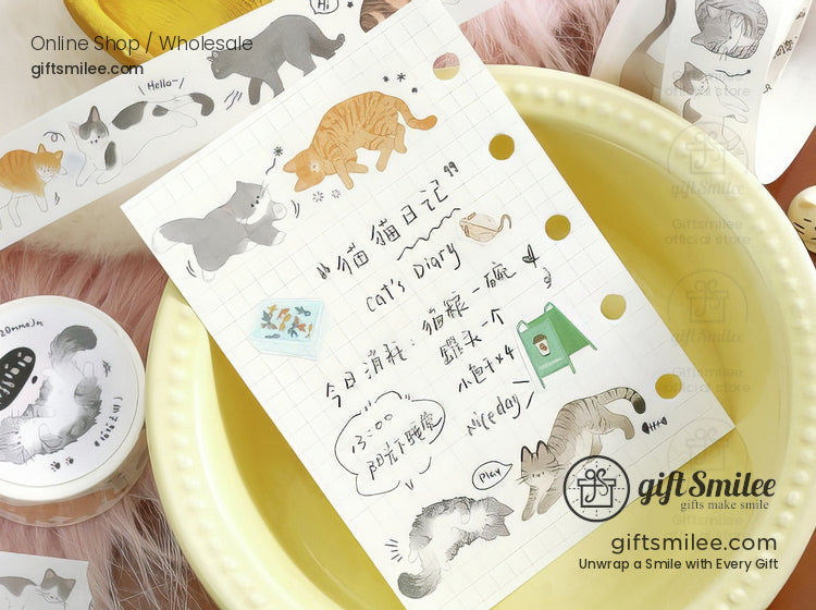 Whimsical catthemed stationery with colorful illustrations Japanese text and gold accents on white grid paper