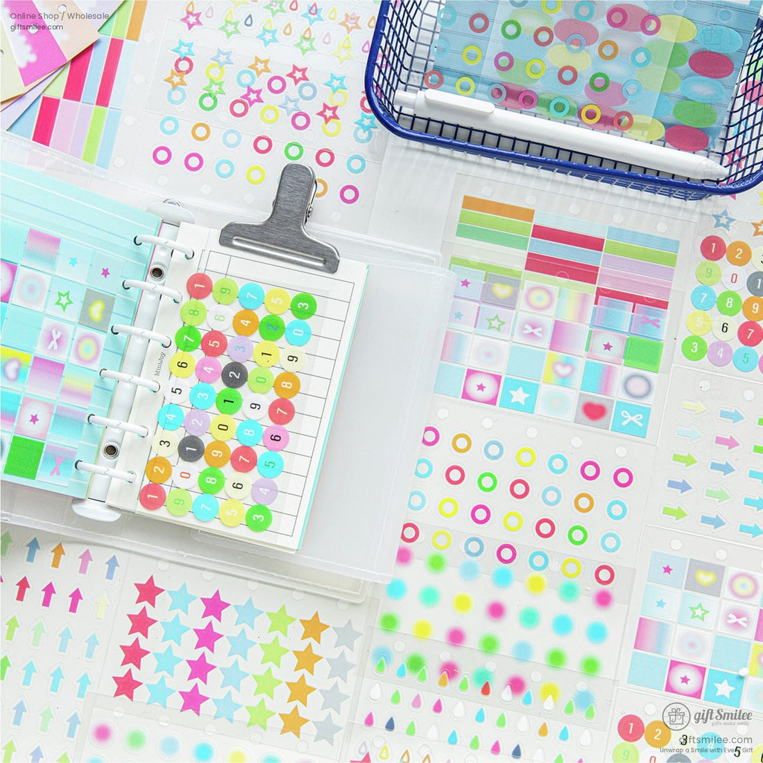 A variety of colorful planner stickers organized in a binder with vibrant designs