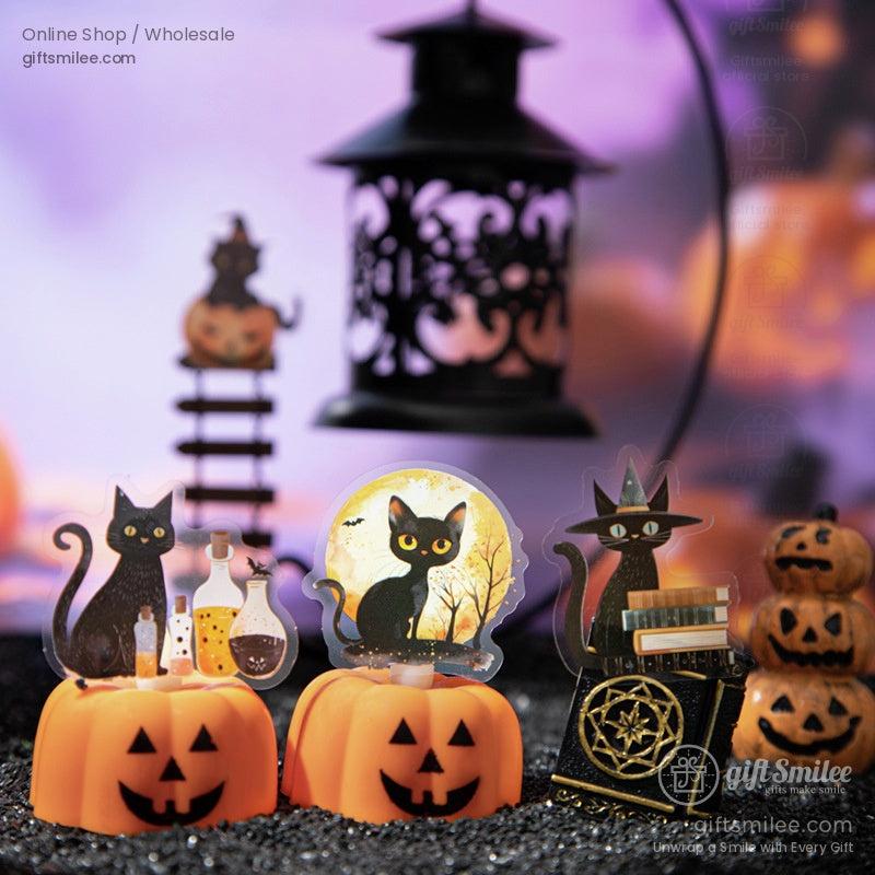 Halloween black cats displayed with jack-o-lanterns, potions, and eerie lantern decor