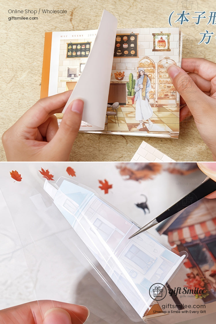 Transparent decorative stickers being cut and peeled for scrapbooking, featuring cozy café and autumn designs.