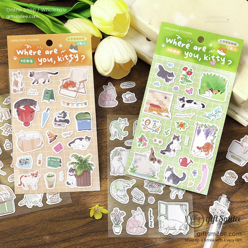 Two sheets of catthemed stickers with pastel backgrounds featuring playful felines plants and cozy household items