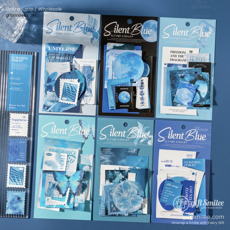 Assorted blue stationery sets with moon floral and butterfly designs featuring stamps cards and decorative elements
