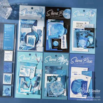 Assorted blue stationery sets with moon floral and butterfly designs featuring stamps cards and decorative elements