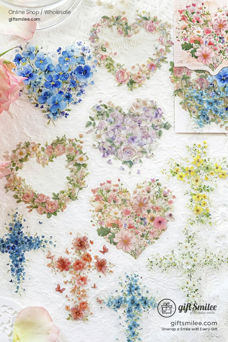 Floral heart and crossshaped stickers with pastel roses daisies and hydrangeas on a white lacetextured background