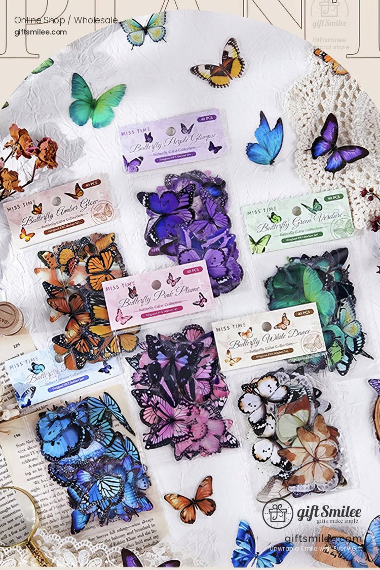 Assorted colorful butterfly stickers in vibrant orange purple blue and green hues on a white textured surface