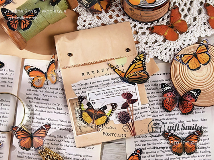Wooden stationery set with vibrant orange and black butterfly decorations vintage papers and lace doily accents