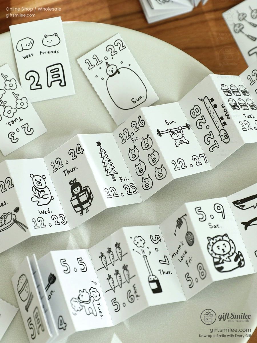 Black and white mini calendar pages with handdrawn cute animal doodles playful designs and a foldable layout