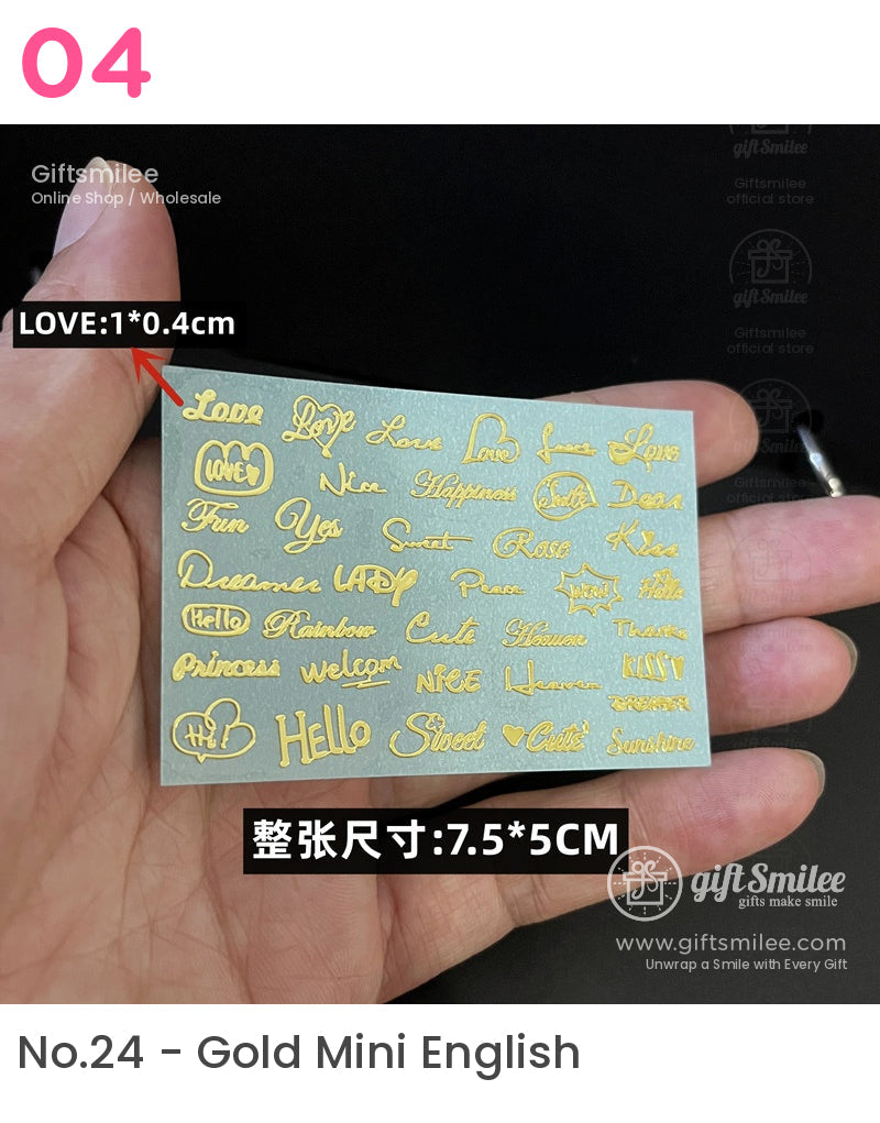 Gold foil adhesive stickers with various words and phrases in cursive and decorative fonts on a 75x5cm sheet