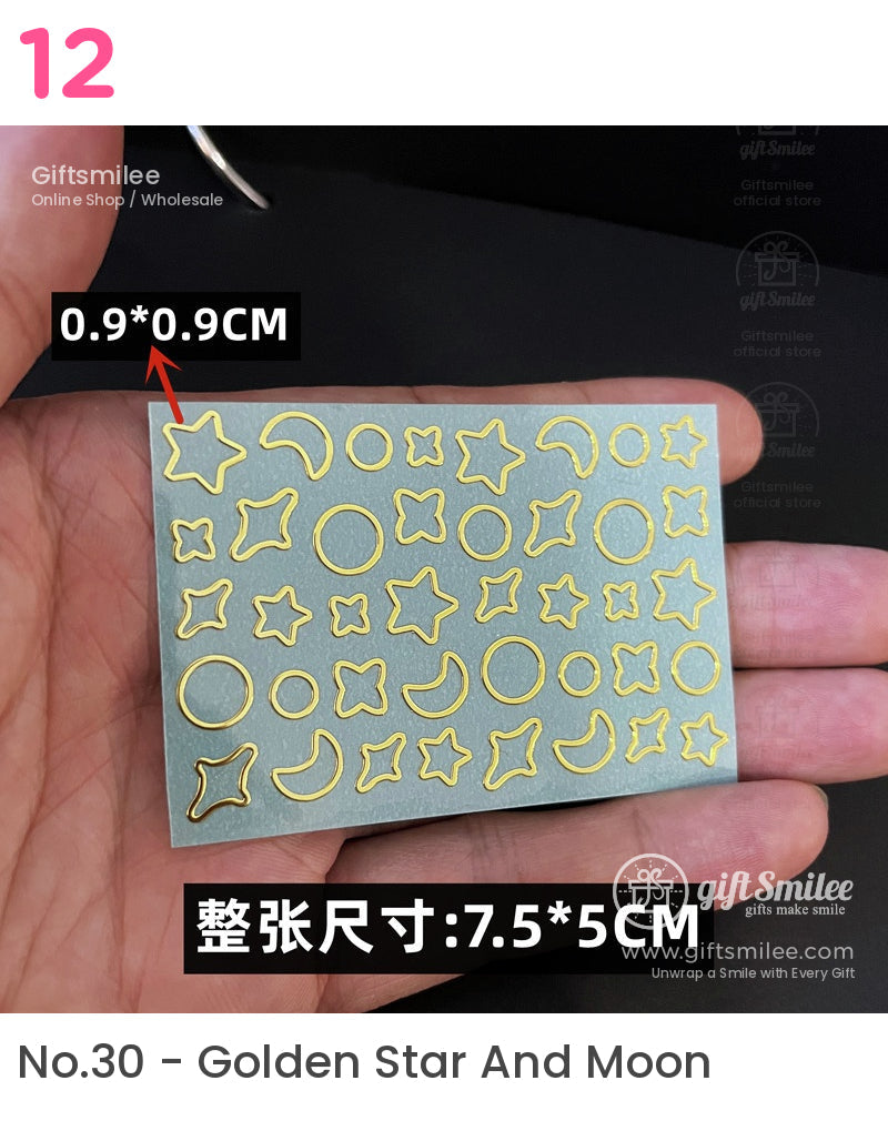 Gold metallic star moon and circle nail art stickers on a gray sheet measuring 75x5 cm with 09x09 cm designs