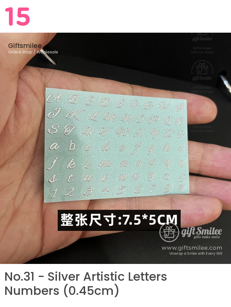 Metallic silver alphabet and number stickers on a small light blue sheet showcasing cursive font size 75x5 cm