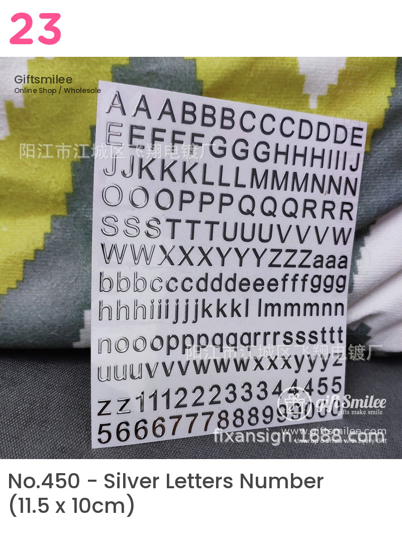 Black adhesive vinyl letters and numbers on a white sheet uppercase and lowercase in bold sansserif font