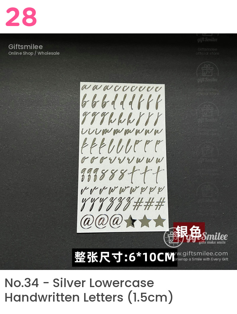 Silver adhesive alphabet stickers in cursive font on a 6x10 cm white sheet including stars and symbols