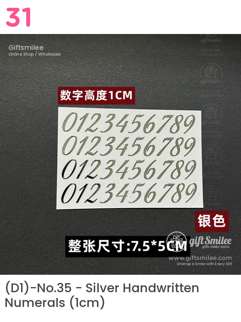 Silver adhesive number stickers with a 1cm height sleek font arranged on a 75x5cm white sheet against a black background