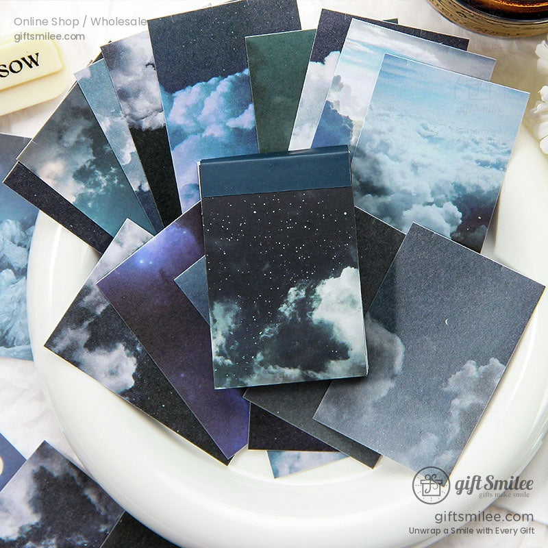 Colorful pocketsized notebooks with scenic skythemed covers featuring vibrant sunsets starry nights and cloudy skies