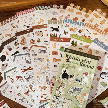 Assorted decorative sticker sheets with playful cat and animal illustrations in colorful whimsical designs