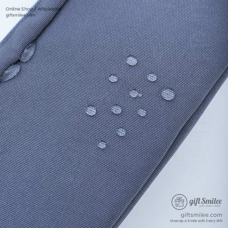 Waterproof feature of the gray pencil case with water droplets on fabric