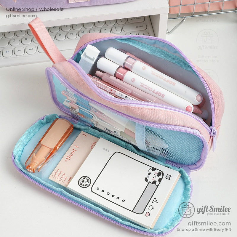 Open pastel pencil case showcasing compartments filled with pens and stationery