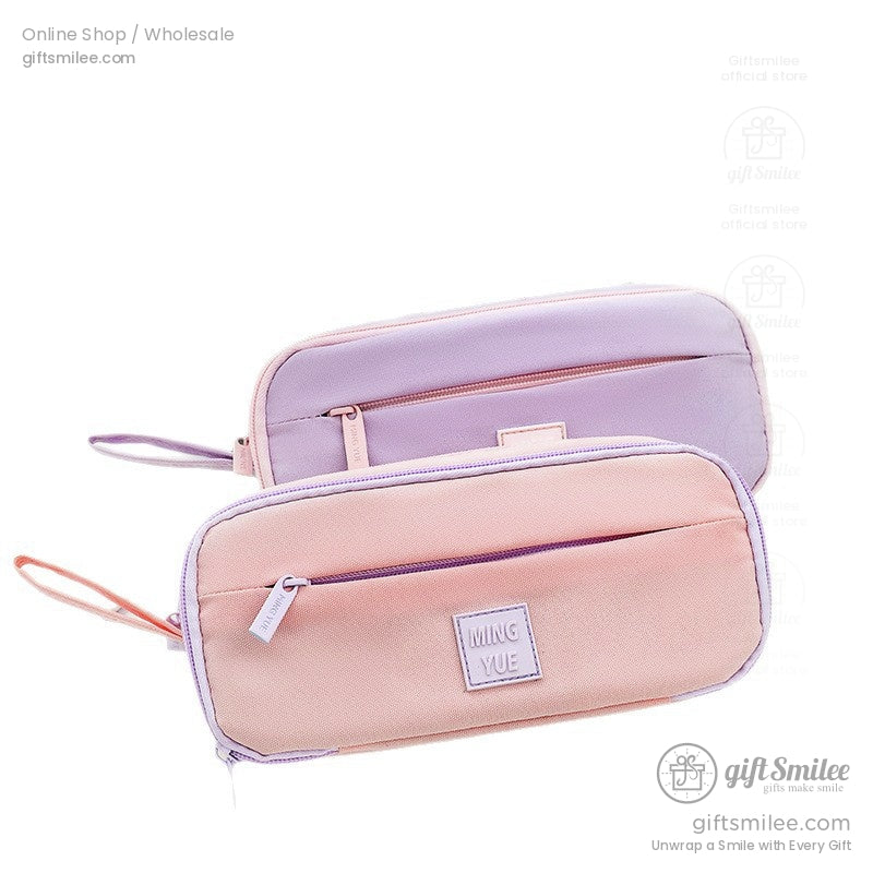 Pink and purple pastel pencil cases displayed on a white background