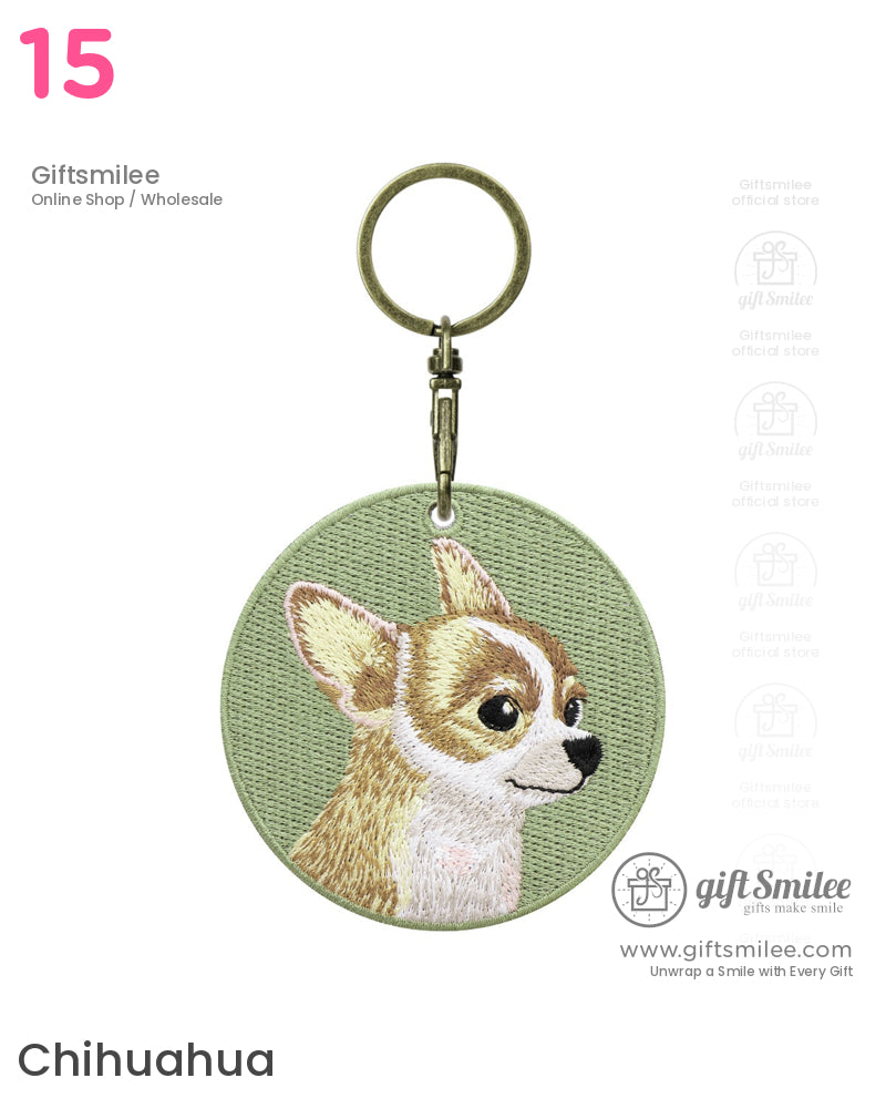 Olive green round keychain with embroidered tan and white chihuahua design antique brass clasp and textured finish