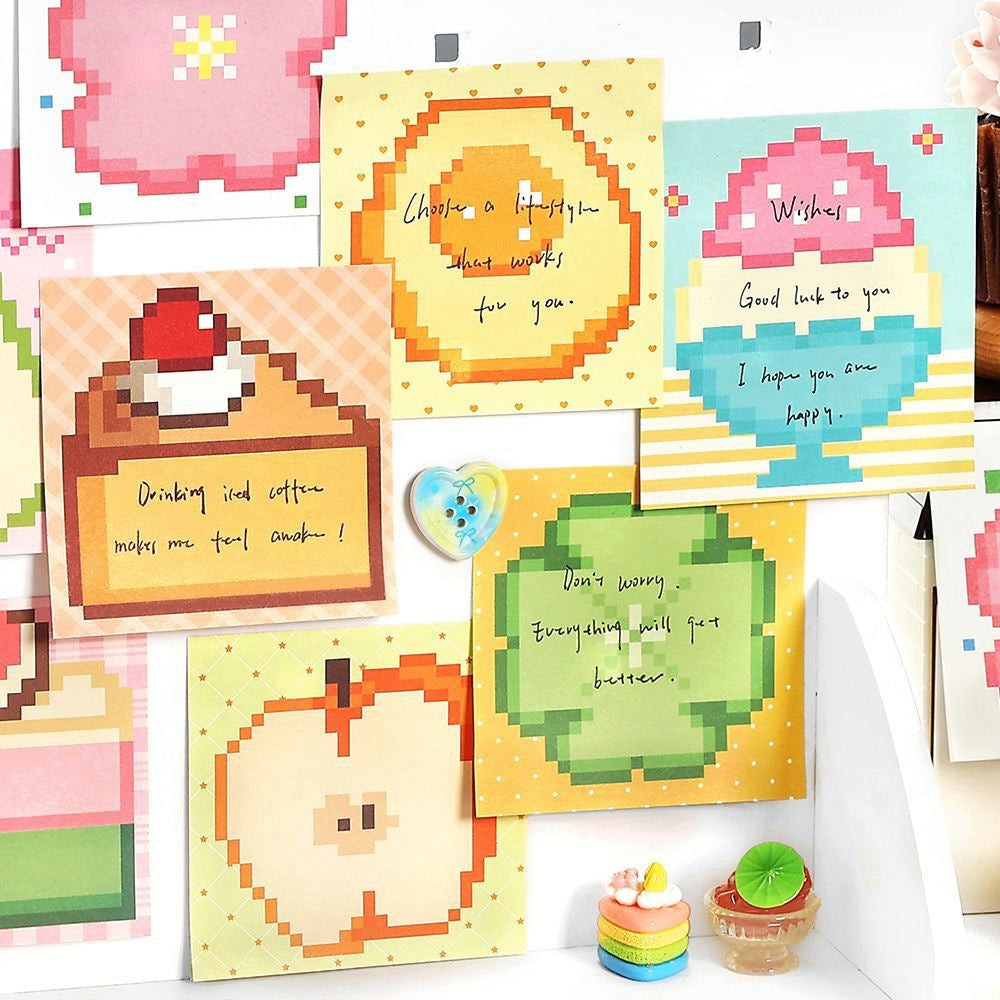 Colorful pixel art sticky notes with fruit and dessert designs pastel tones and motivational handwritten messages