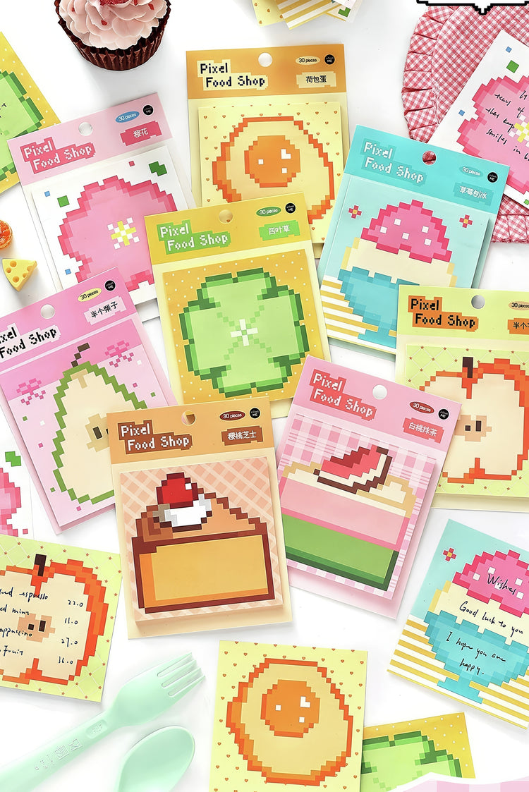 Assorted pixel art stationery with colorful fruit and dessert designs on pastel packaging ideal for creative notes