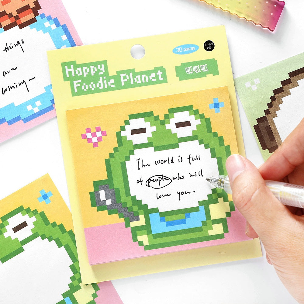 Colorful sticky notes with pixelated green frog design pastel yellow and pink background and motivational text space
