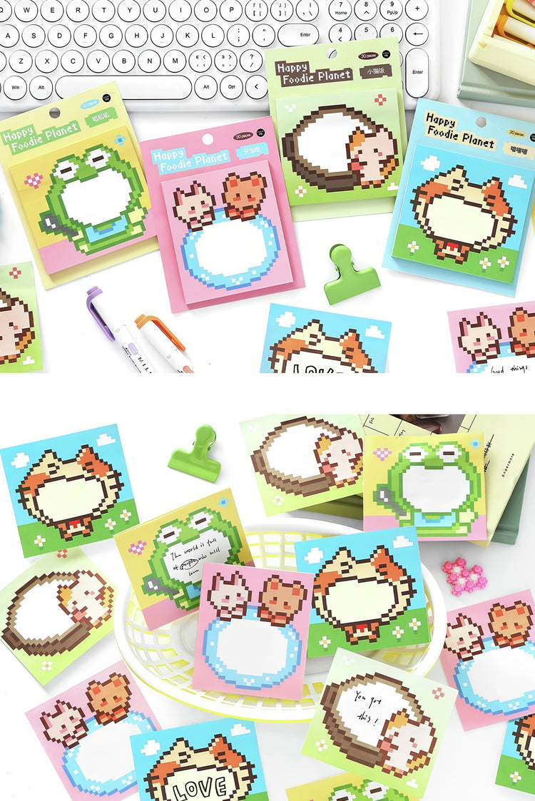 Colorful pixel art sticky notes with animal designs including cats frogs and hamsters on green pink and blue backgrounds