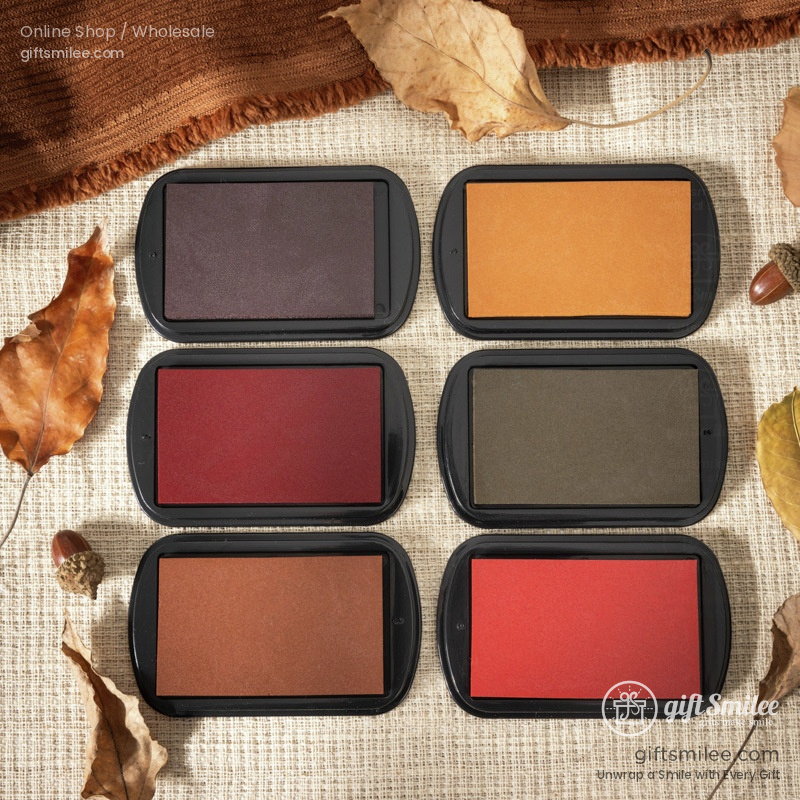Six rectangular ink pads in black cases with autumn hues deep purple golden yellow burgundy olive green bronze and redorange