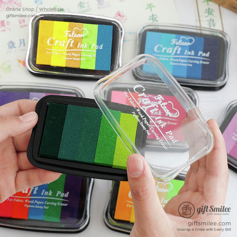 Multicolor craft ink pad with vibrant green yellow and teal sections in a rectangular black plastic case