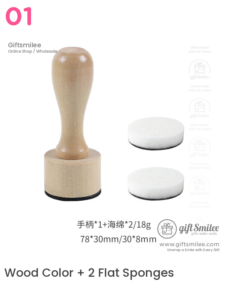 Wooden handle blending tool with a natural finish paired with two round white foam applicator pads for crafting or stamping